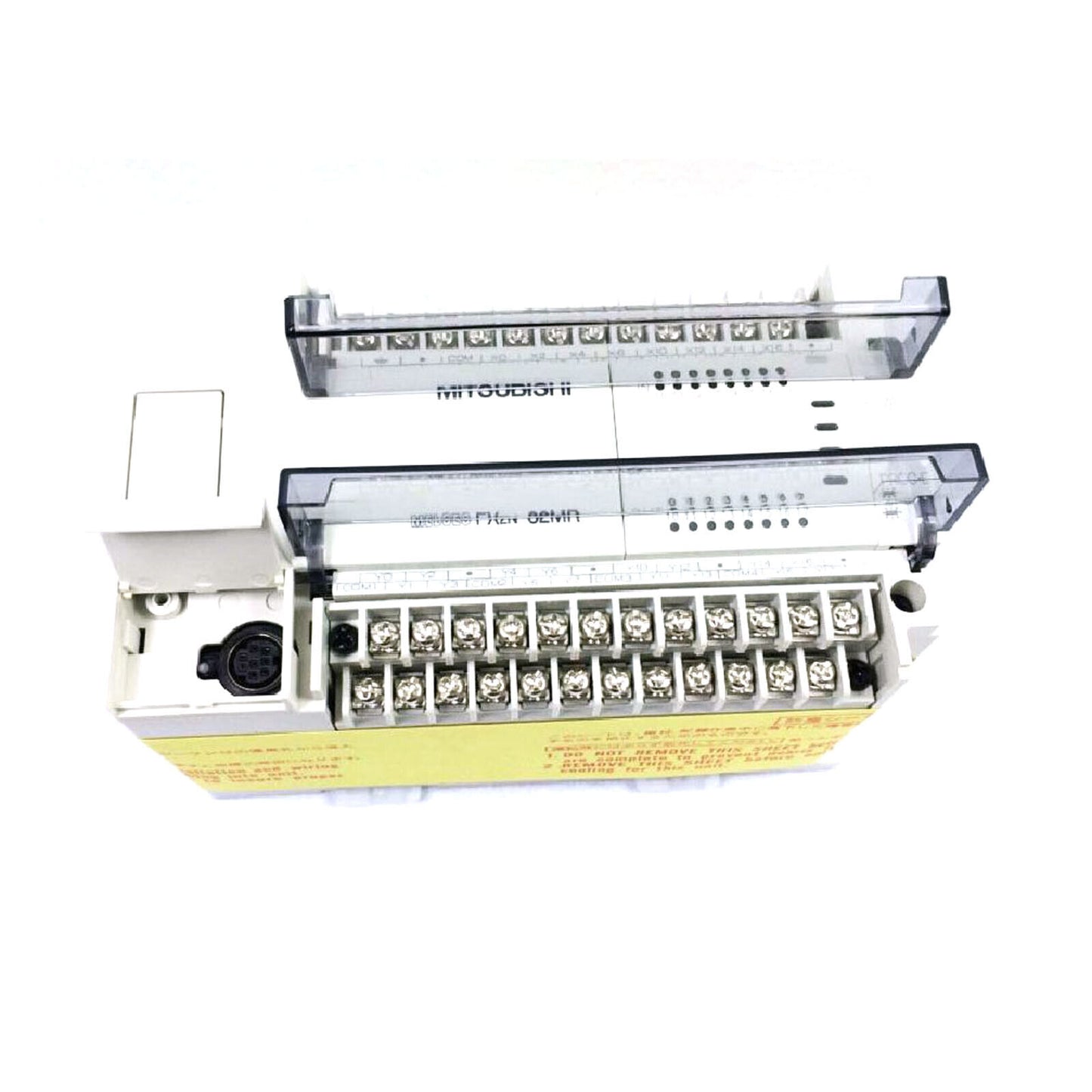 Mitsubishi FX2N-16MR PLC Programmable Controller. White and beige PLC unit with clear protective covers and terminal blocks.