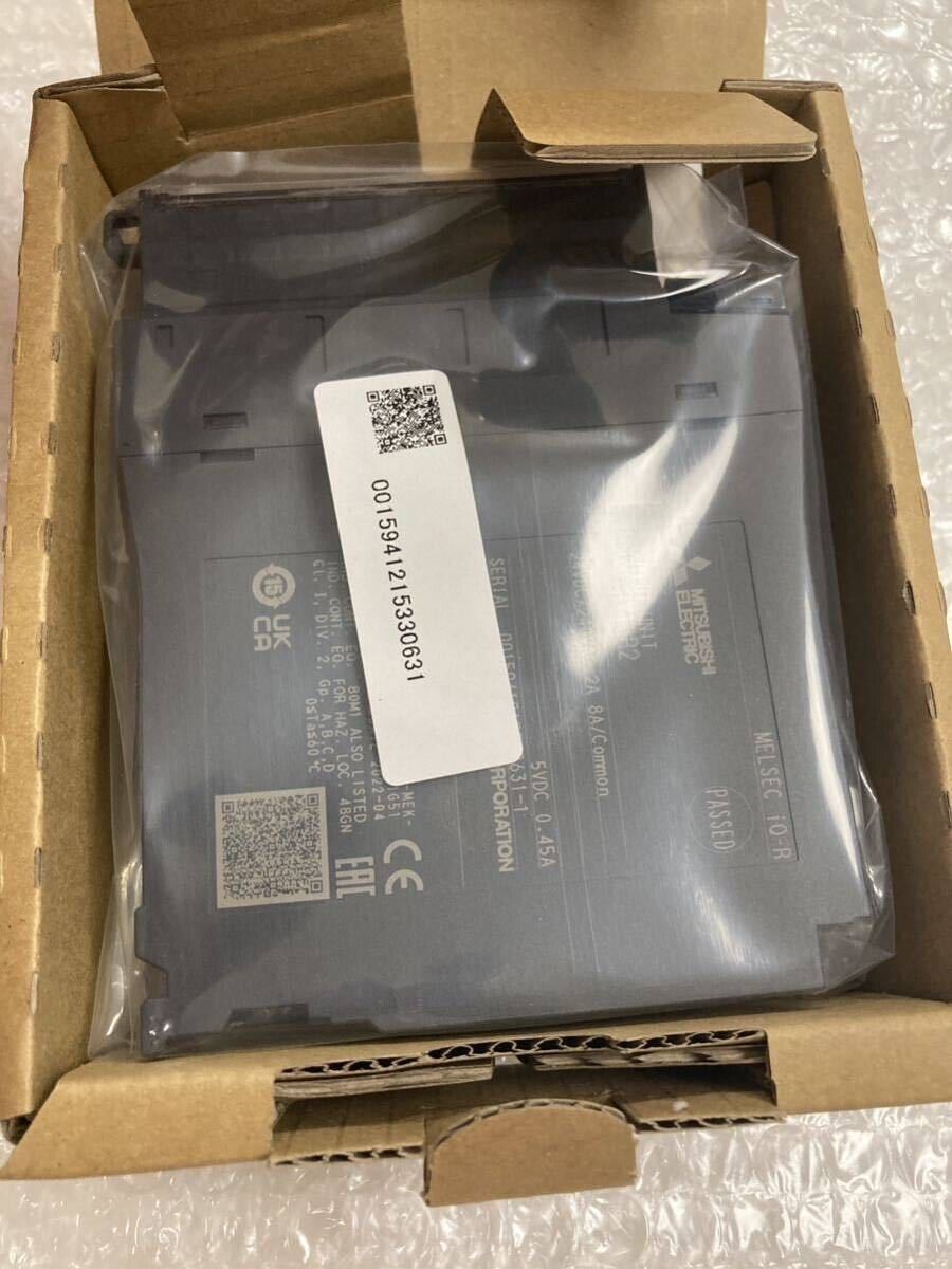 Mitsubishi MELSEC iQ-R PLC Module in Box - New, featuring product info, serial number, and the 'PASSED' seal. Model TQ-R