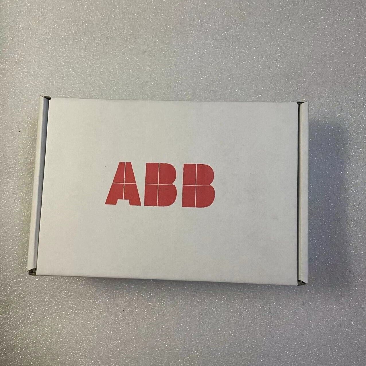ABB FEIP-21 Ethernet/IP Adapter Module box, top view, white box with red ABB logo, New in Stock.