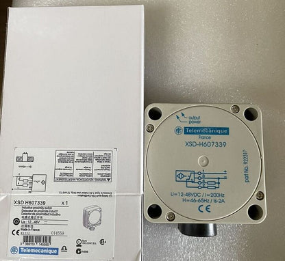 Schneider Electric XSD-H607339 inductive proximity sensor, white casing, and box.