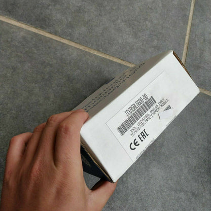 FANUC IC695ALG600-DD Universal Analog Input Module box, General Electric RX3i PLC part, held in hand.
