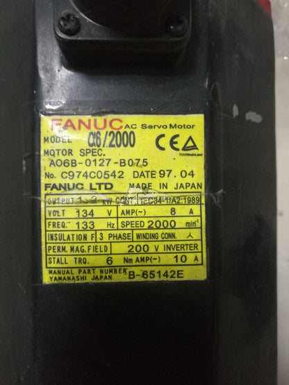 FANUC A06B-0127-B075 servo motor, black with yellow label showing specifications, industrial automation part