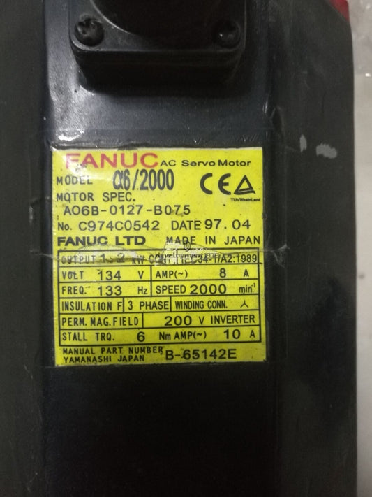 FANUC A06B-0127-B075 servo motor, black with yellow label showing specifications, industrial automation part