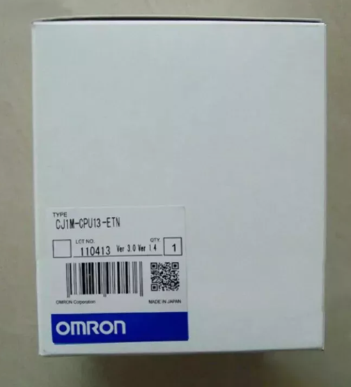 Omron CJ1M-CPU13-ETN PLC Module box, white packaging with product label, Made in Japan.