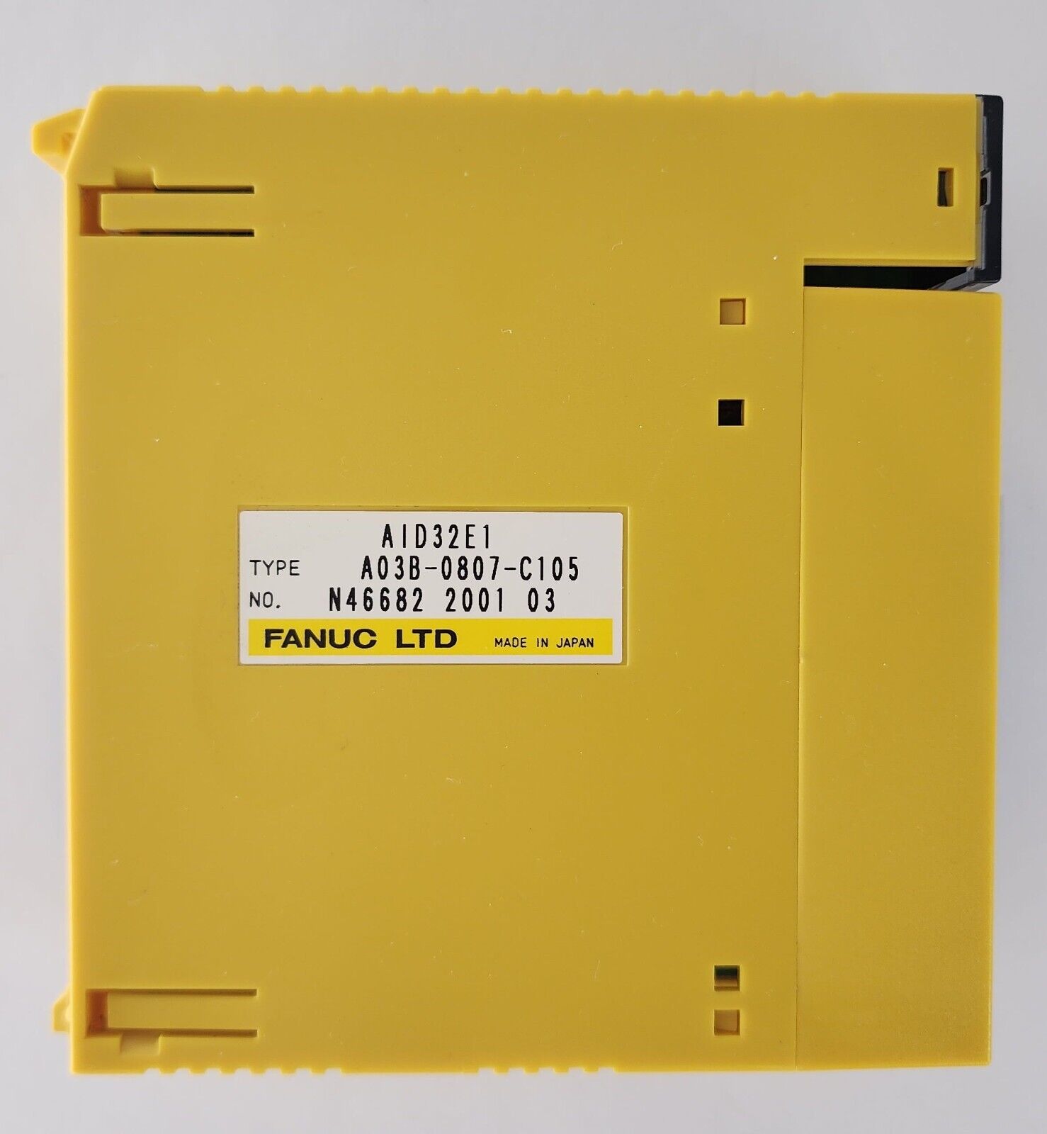 FANUC A03B-0807-C105 I/O Interface Module AID32E1, yellow industrial PLC module.
