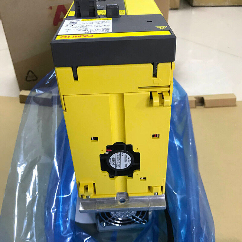FANUC A06B-6222-H015#H610 Servo Amplifier, yellow and black, industrial automation part, with cooling fan.