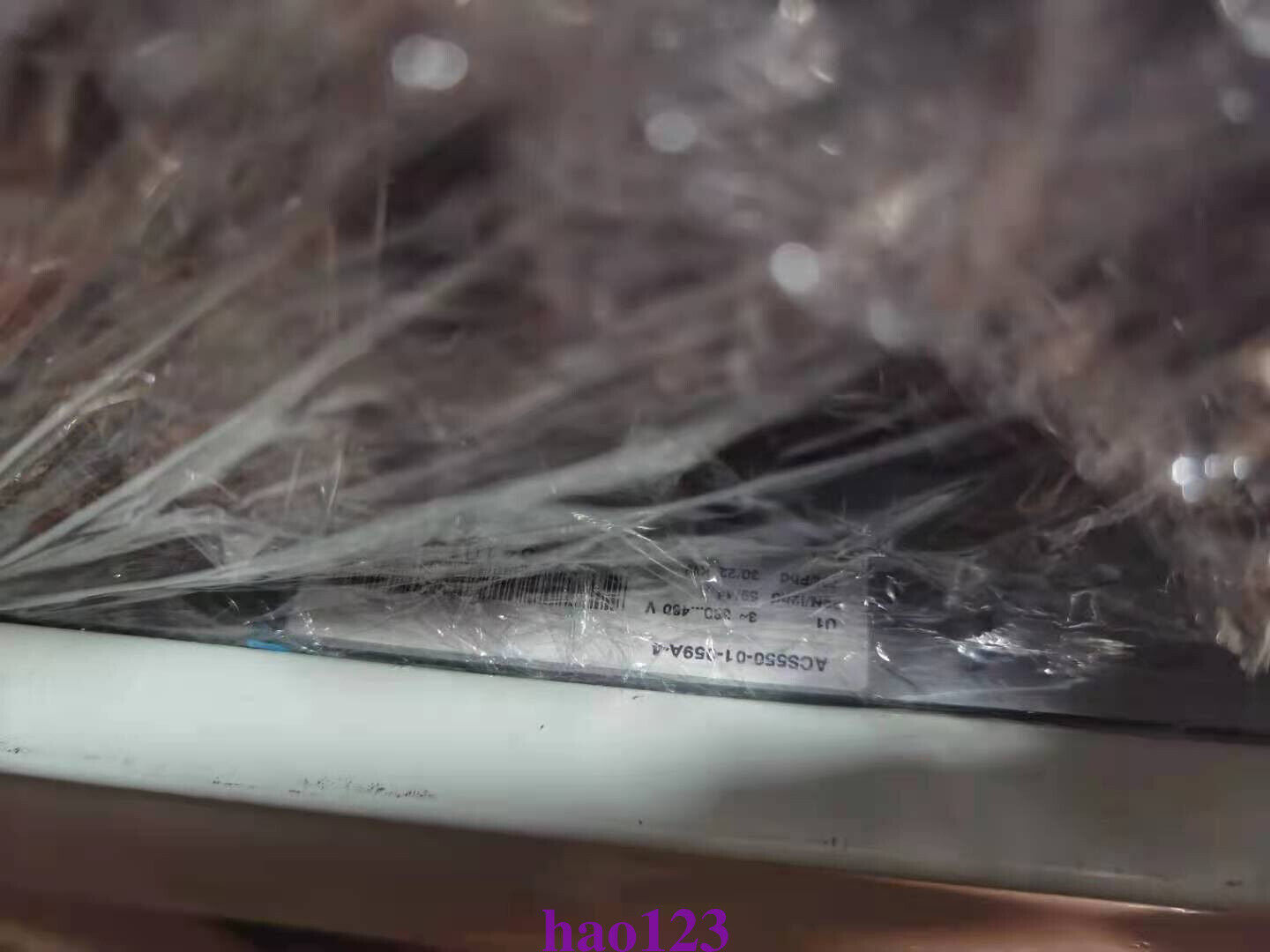 ABB ACS550-01-159A-4 frequency converter wrapped in plastic. Product label visible, industrial automation part.