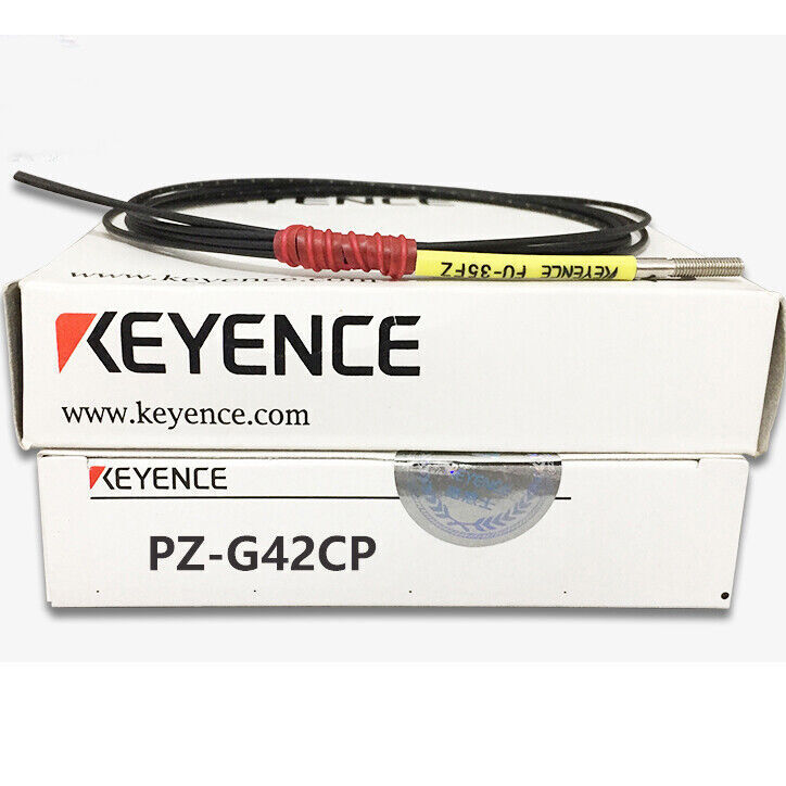 Keyence PZ-G42CP photoelectric sensor product shot, with a box and sensor cable