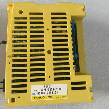 FANUC A02B-0259-C180 I/O board. Yellow industrial automation component with ventilation slots and label.