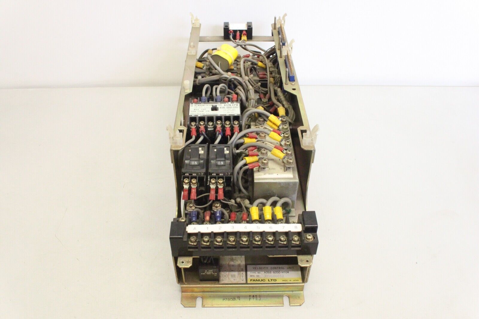 FANUC A06B-6050-H104 velocity control unit with visible electrical components, product shot