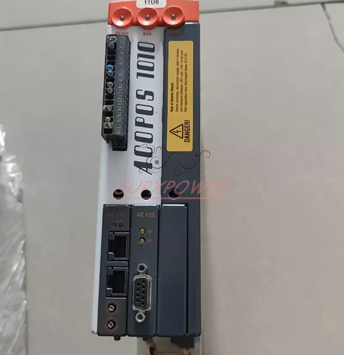 B&R ACOPOS 1010 servo drive unit, angled shot, showing ports and warning label, industrial equipment