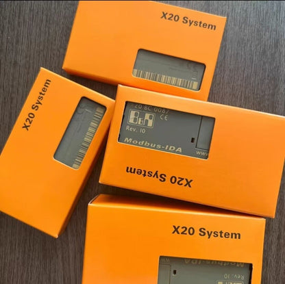 B&R X20 System modules in orange packaging, featuring X20BC0087, Rev. 10, and Modbus-IDA labels.