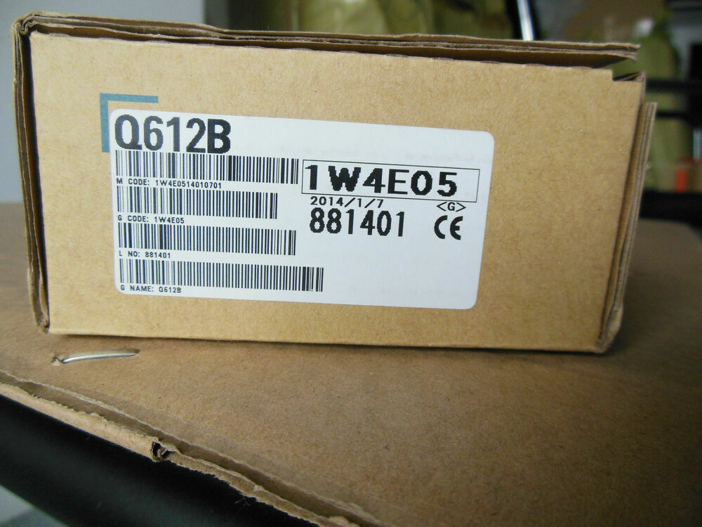 Mitsubishi Q612B PLC Base Unit box with labels, part number 1W4E05, fast shipping.