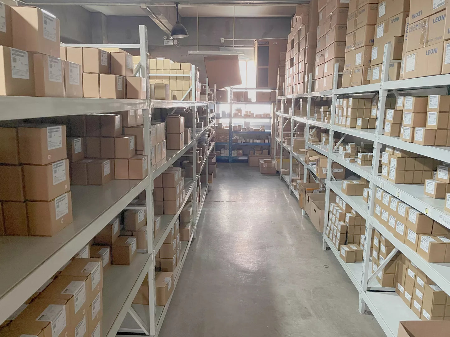 Warehouse of industrial automation parts, Siemens VFDs and other equipment stocked.