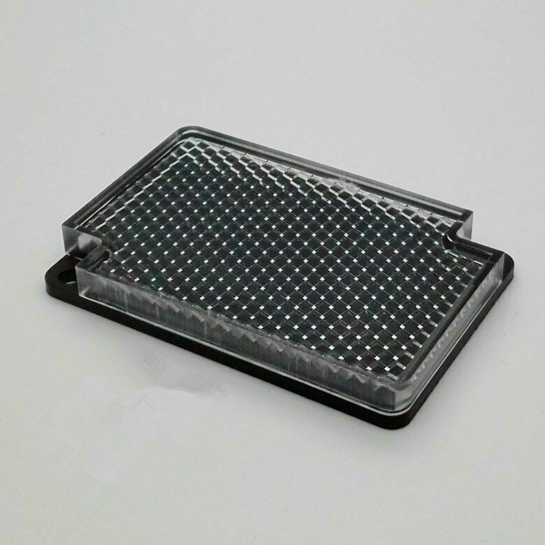 Omron E39-R1 reflector sensor, rectangular with clear lens and reflective grid, black base, industrial automation part.