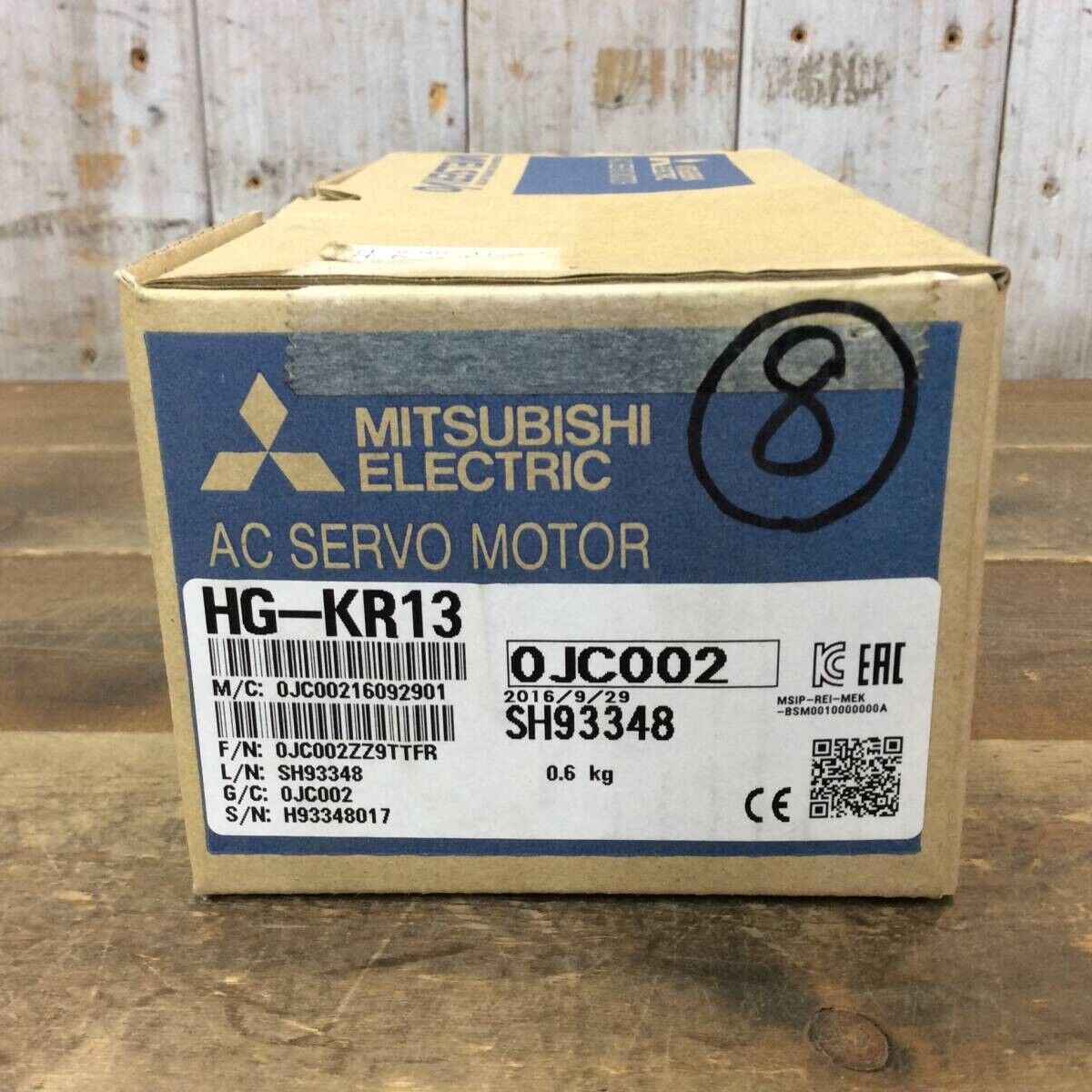 Mitsubishi HG-KR13 AC Servo Motor box, industrial automation part, featuring product details and serial numbers.