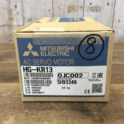 Mitsubishi HG-KR13 AC Servo Motor box, industrial automation part, featuring product details and serial numbers.