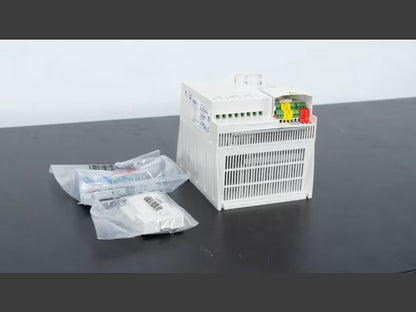 ABB ACS355-03U-15A6-4 DRIVE ACS35503U15A64 industrial drive, white housing, with wiring connections and accessories.