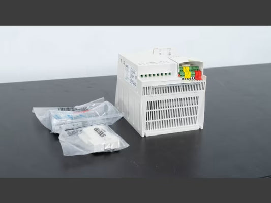 ABB ACS355-03U-15A6-4 DRIVE ACS35503U15A64 industrial drive, white housing, with wiring connections and accessories.