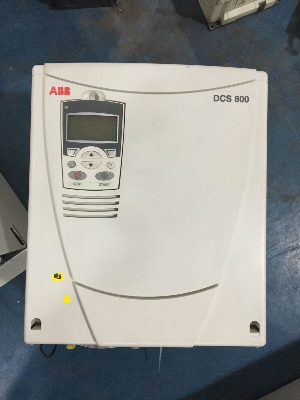 ABB DCS 800 DC Governor PLC. White housing with digital display and control buttons. Industrial automation equipment.