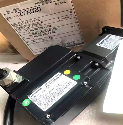 Mitsubishi HS-MF23EXV-S2 servo motor, black, with label details including model number, specifications, and Made in Japan.