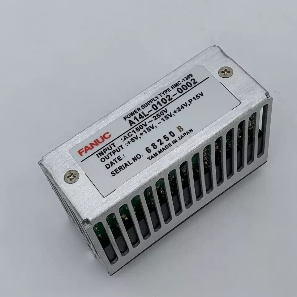 FANUC A14L-0102-0002 Module. Silver enclosure, power supply details, and Made in Japan.