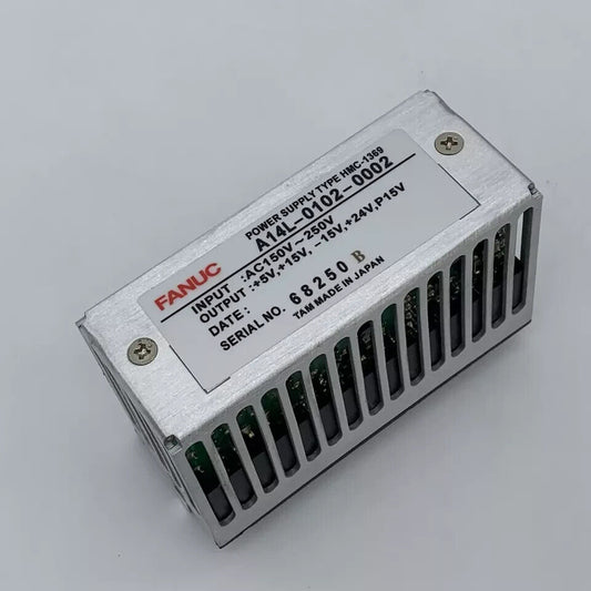 FANUC A14L-0102-0002 Module. Silver enclosure, power supply details, and Made in Japan.