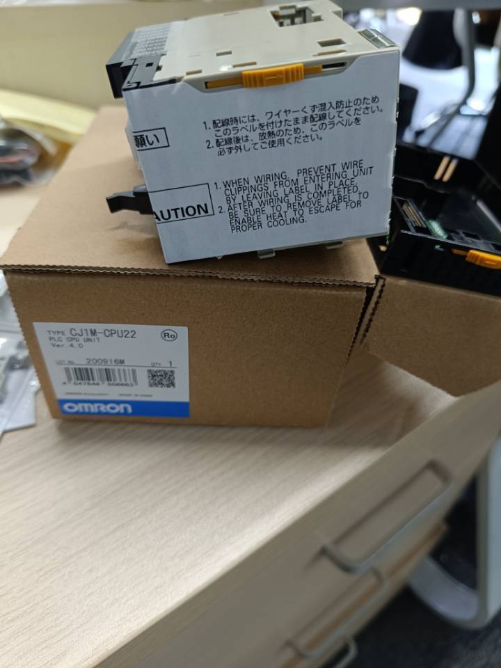 Omron CJ1M-CPU22 PLC CPU Unit in box, new condition, with product information label.