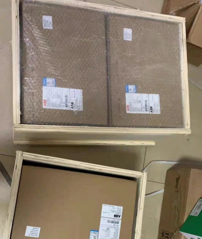 ABB AF1350-30-11 contactor packed in wooden crate, showing ABB labels and product details for industrial automation.