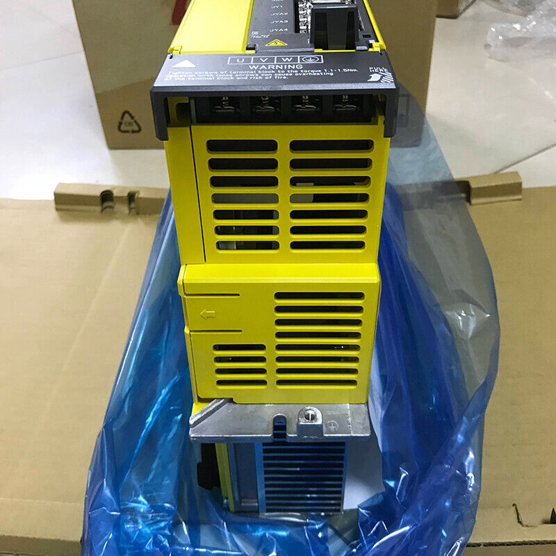 FANUC A06B-6222-H015#H610 Servo Amplifier. Yellow industrial automation part with warning labels.
