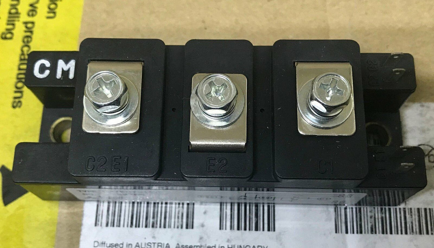 Mitsubishi CM75DY-12H power module inverter, black plastic housing with metal fasteners. Industrial automation component.