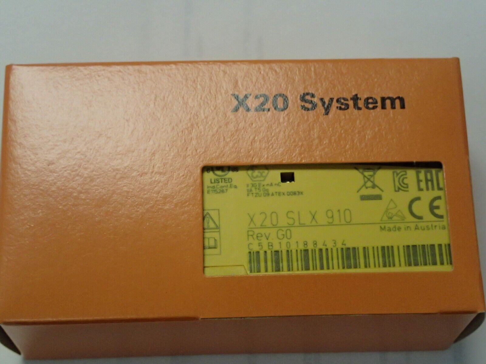 B&R X20 SLX 910 Automation Module Base, Orange box with product details and Made in Austria label.
