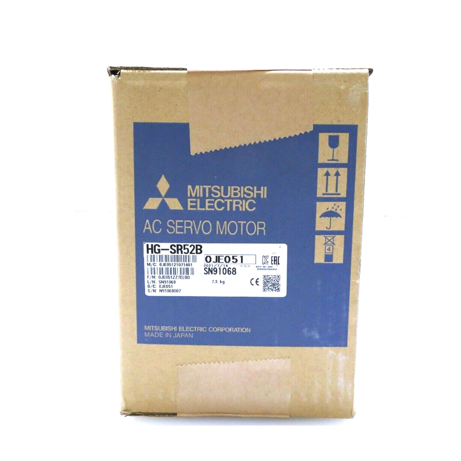 Mitsubishi HG-SR52B AC Servo Motor on a cardboard box, New, industrial automation part