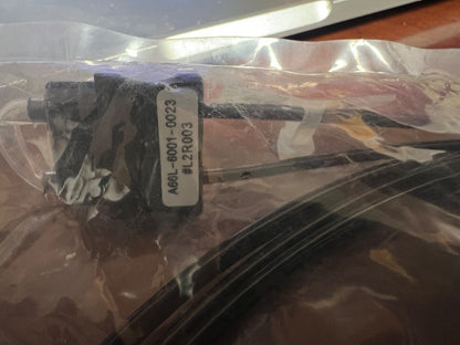 FANUC A66L-6001-0023 SERVO OPTICAL FIBER cable inside a clear bag, industrial automation PLC component.