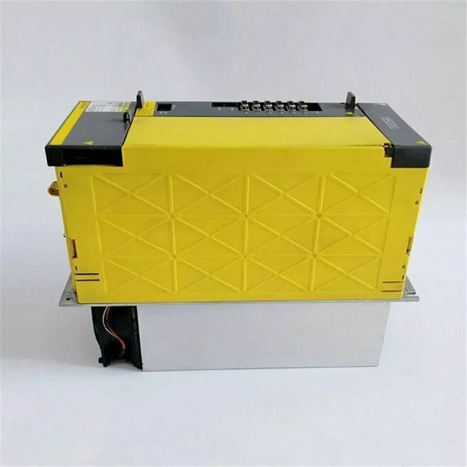 FANUC A06B-6142-H011#H580 Servo Drive, Yellow Unit with silver base. Industrial automation part.
