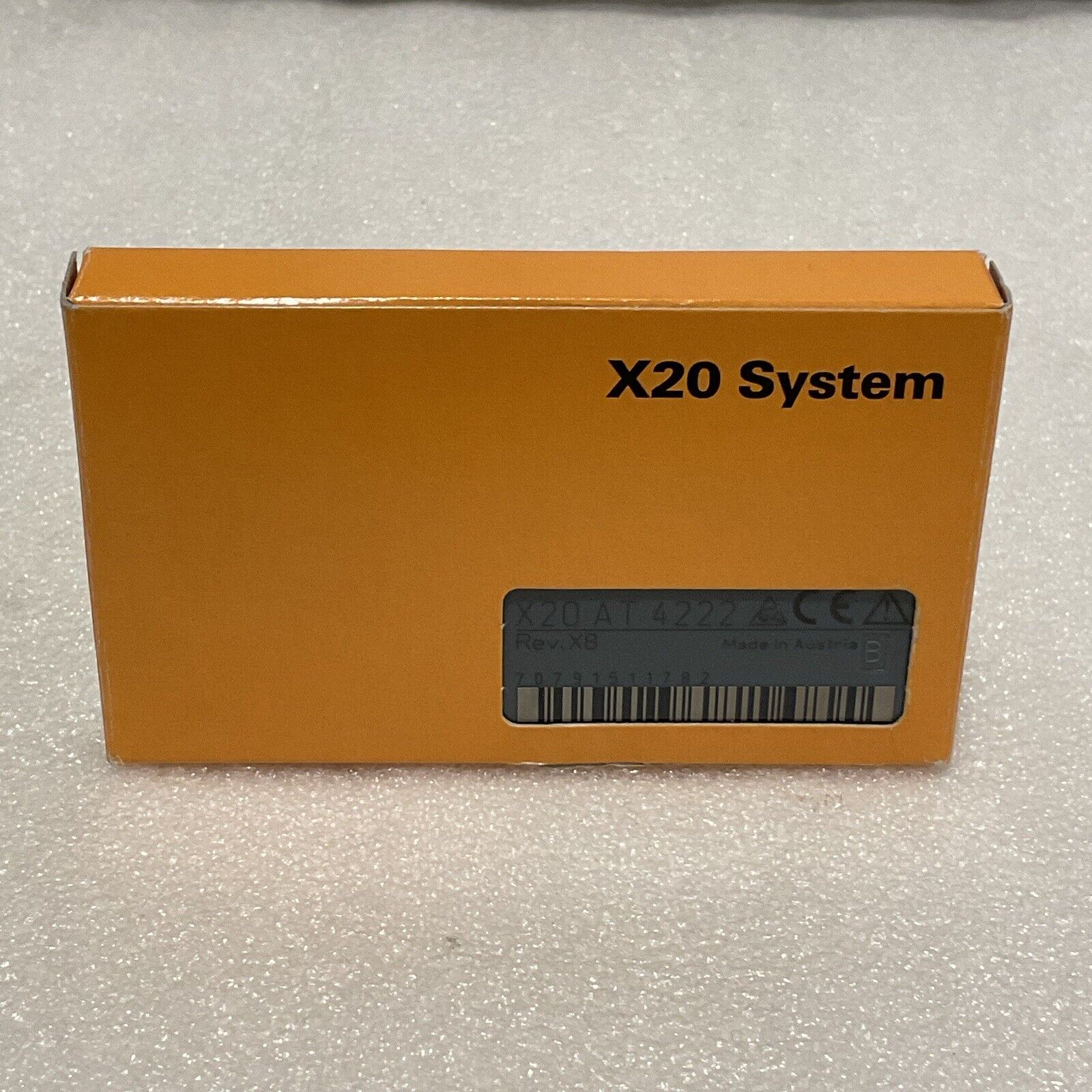B&R X20 System module box in orange, featuring product details like X20 AT 4222 and Made in Austria.