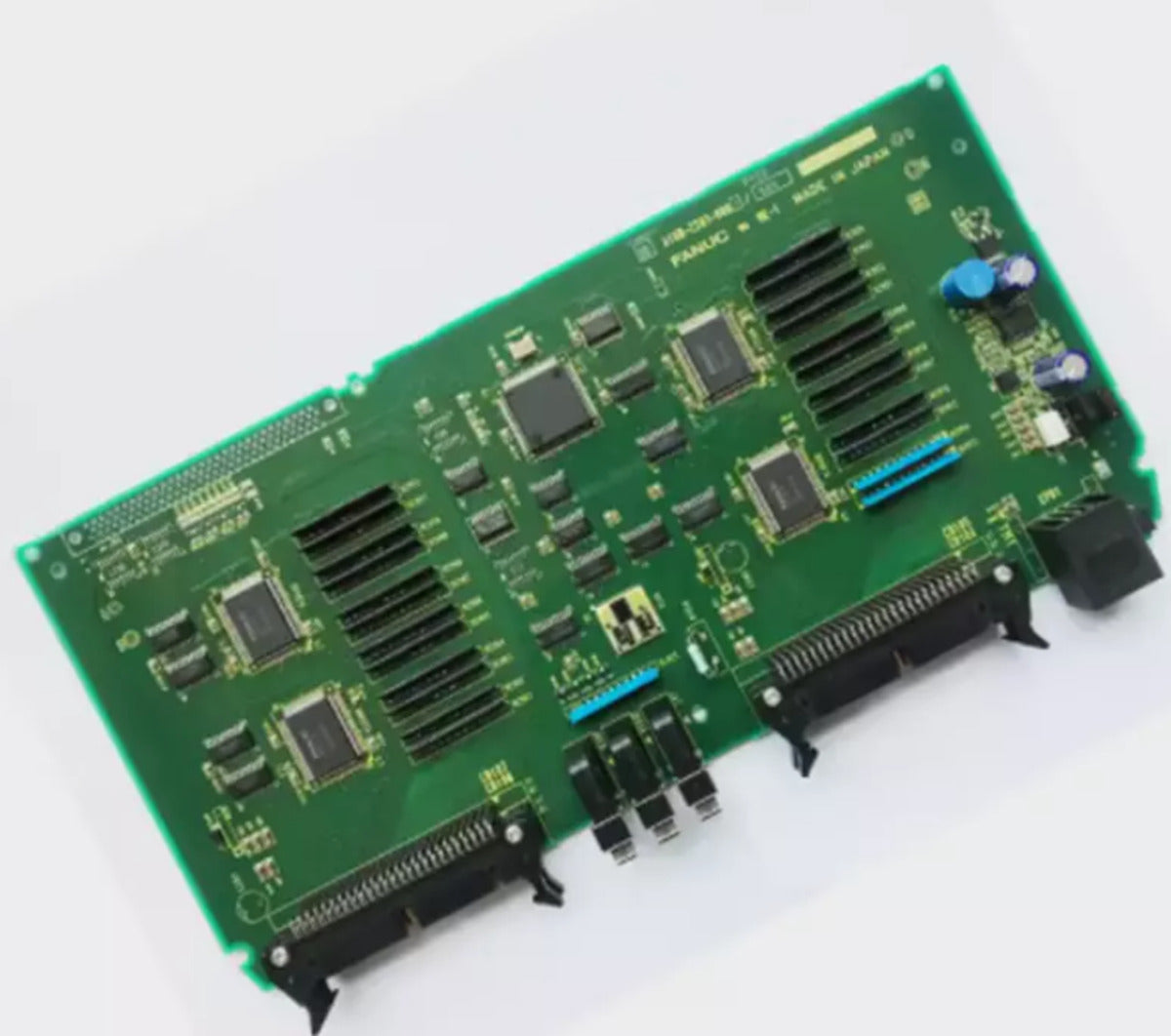 FANUC A16B-2203-0881 PCB board, green circuit board with various components. Made in Japan. Industrial automation spare part.