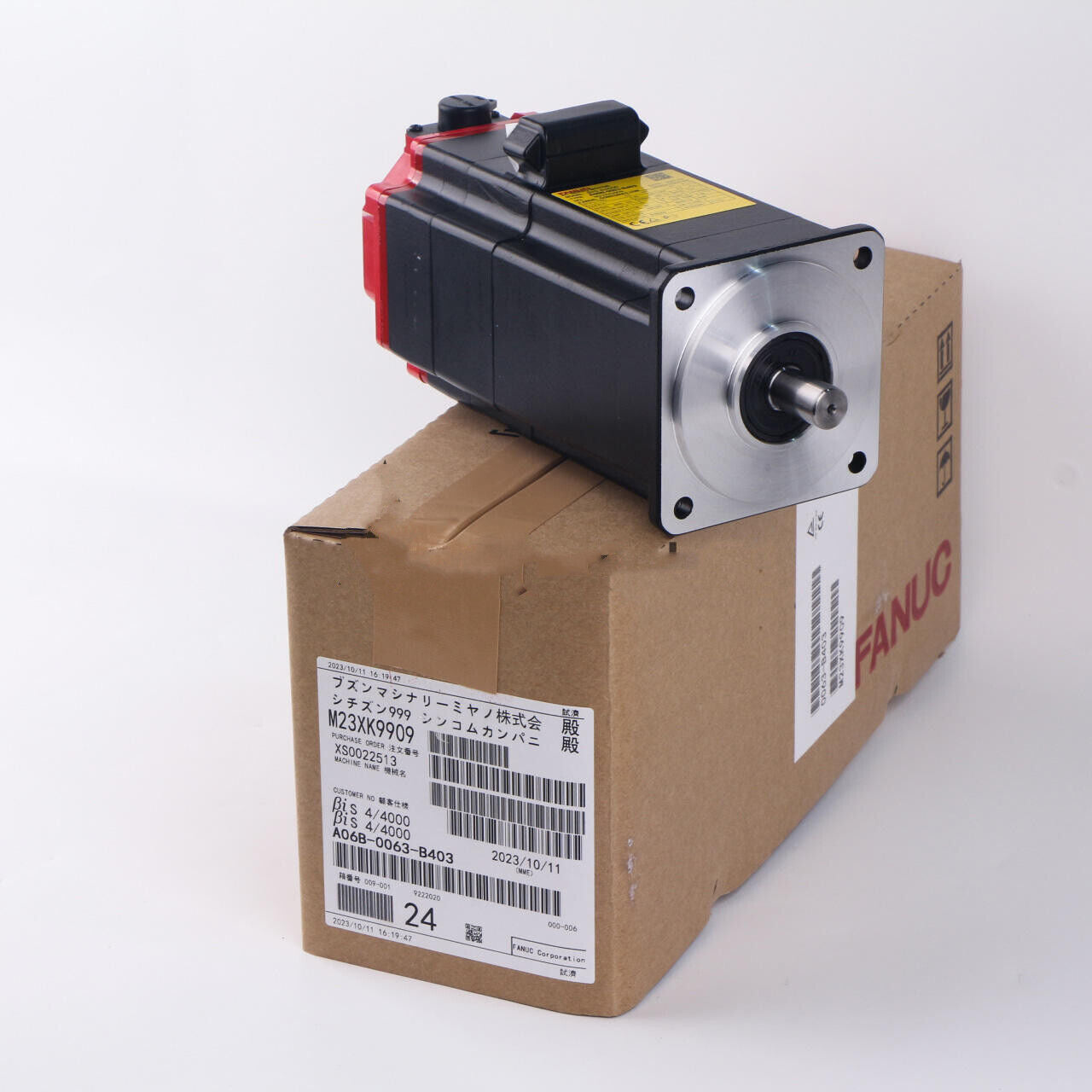 FANUC A06B-0063-B403 AC servo motor on a box, industrial automation component