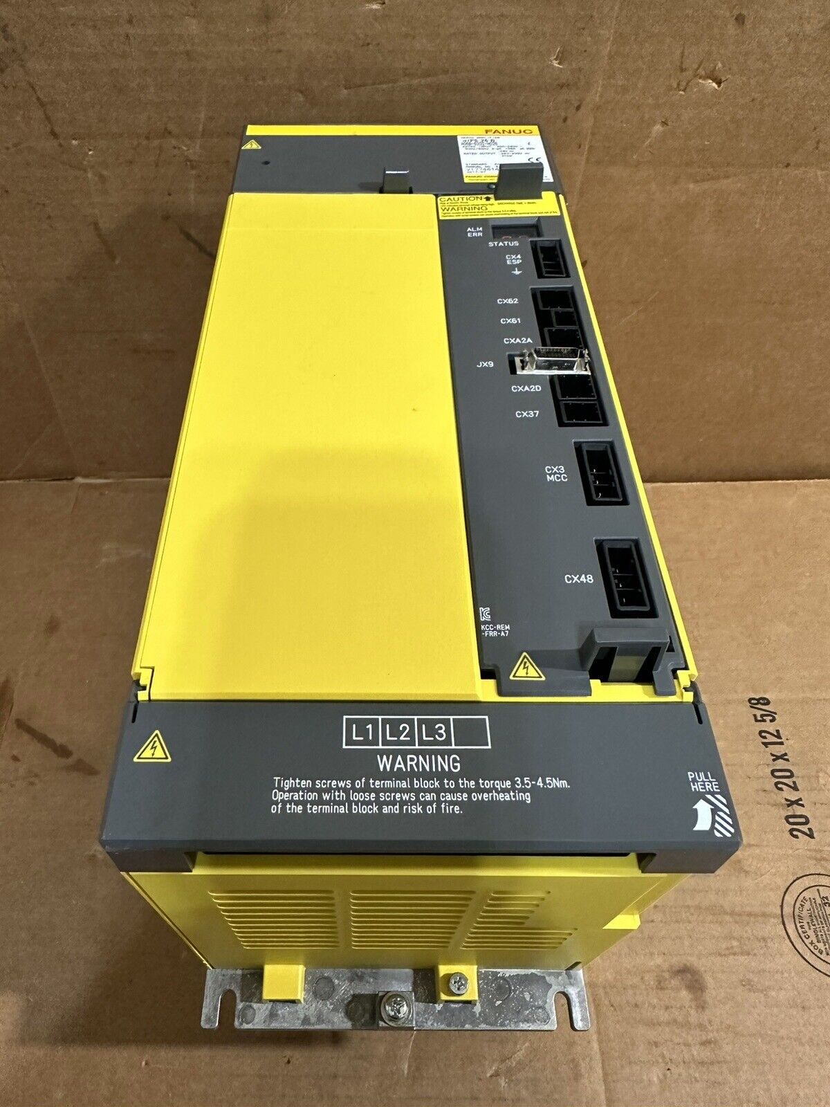 FANUC A06B-6202-H026 industrial power supply, yellow and gray, with warning labels and connection ports.