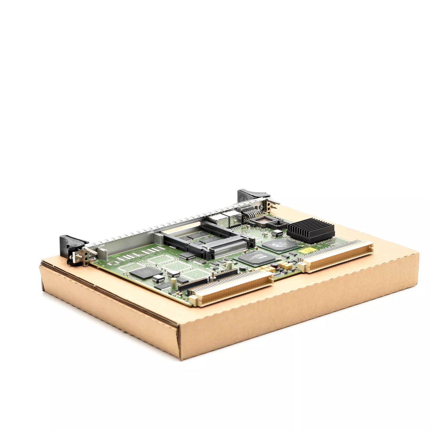 Siemens 6DD1600-0BA2 SIMATIC TDC CPU551 processor module on cardboard, industrial automation part.