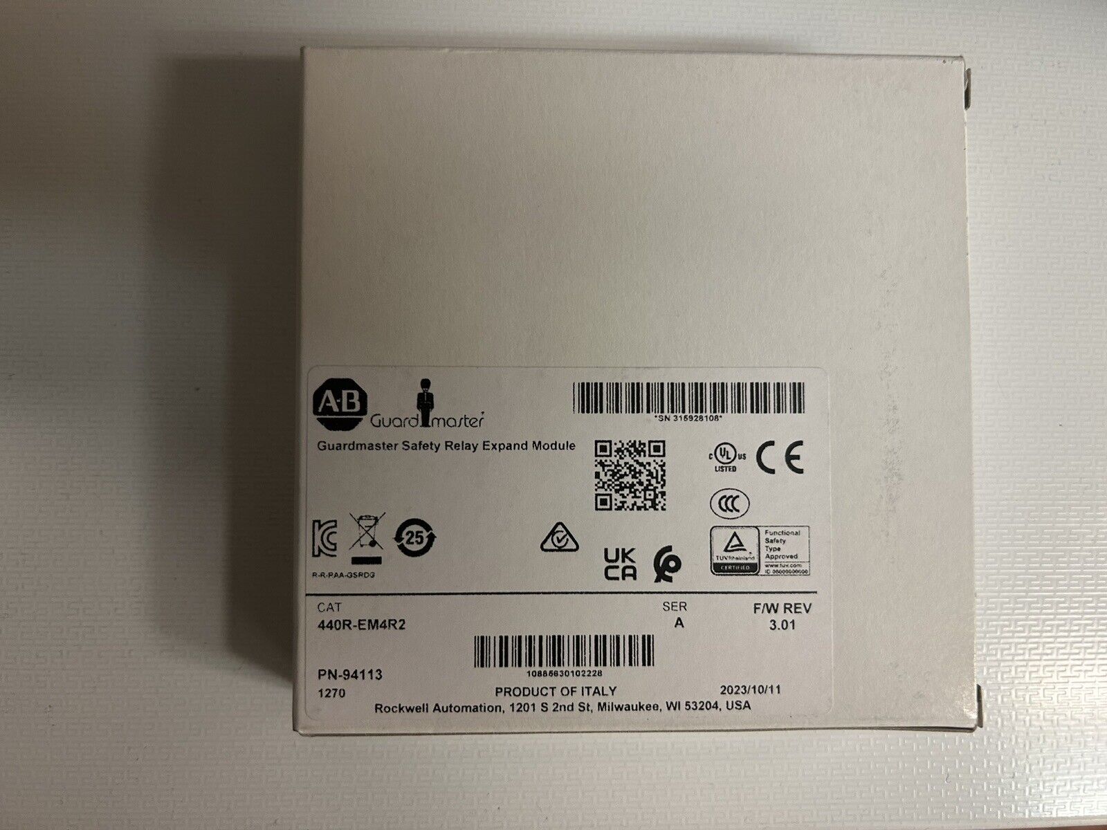 Allen-Bradley 440R-EM4R2 Guardmaster Safety Relay in box, product of Italy, industrial automation part.