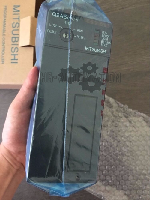 Mitsubishi Q2ASCPU-S1 PLC CPU Equipment in packaging, new original part. Industrial automation part.