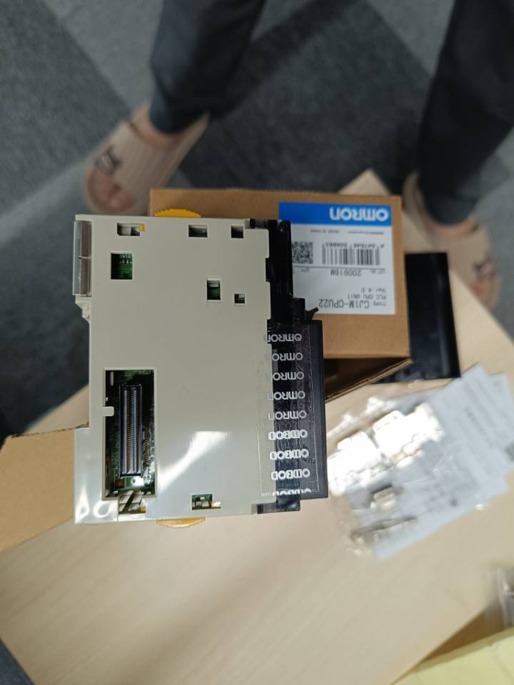 Omron CJ1M-CPU22 PLC CPU Unit, new in box. Industrial automation part.