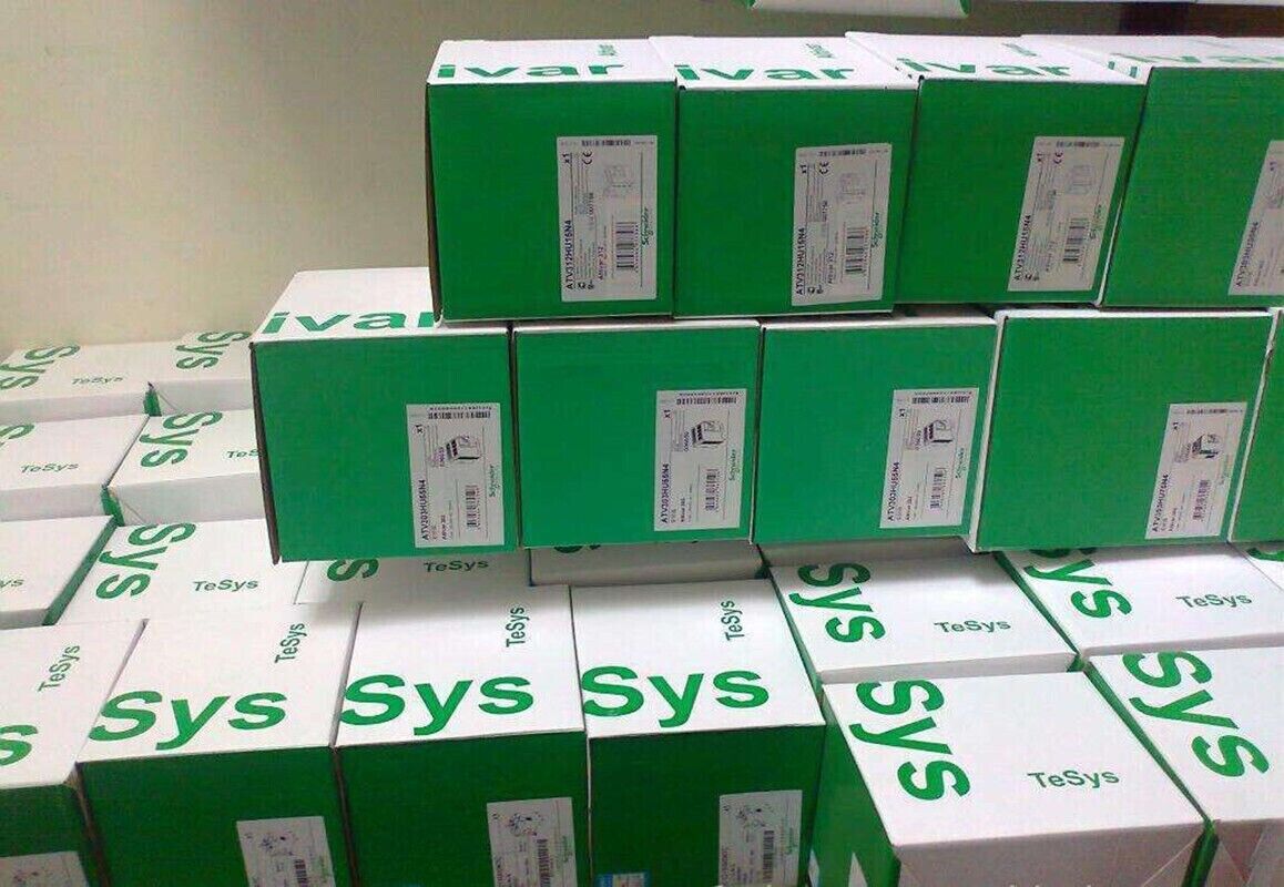 Schneider Electric industrial automation parts in boxes, TeSys, ATV312HU15N4, ATV303HUS5A.