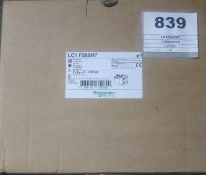 Schneider Electric LC1 F265M7 Contactor on brown cardboard box, industrial automation part.